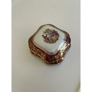 This object is a vintage Limoges porcelain trinket box